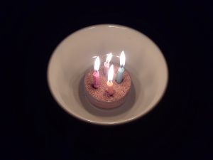 candles stand in for a bonfire