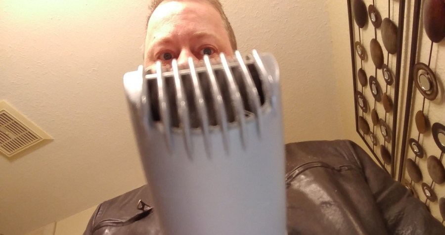 author looking at beard trimmer